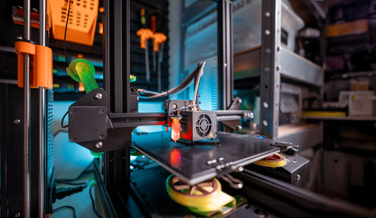 A 3D printer operating in a workshop